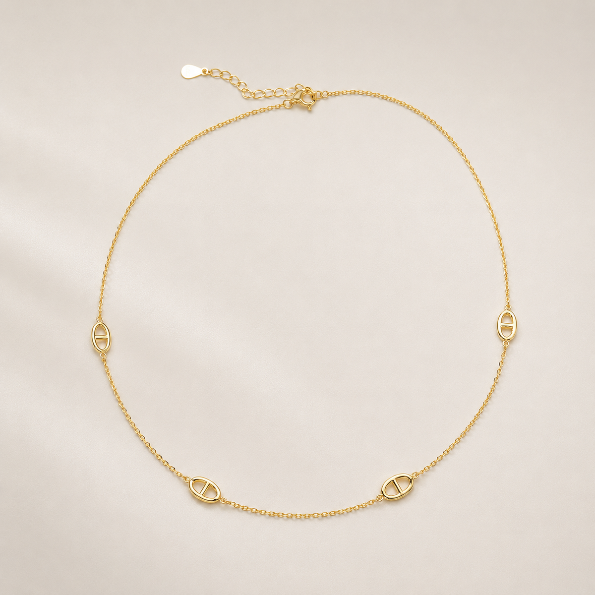 Gold-plated sterling silver station necklace with repeating oval link details