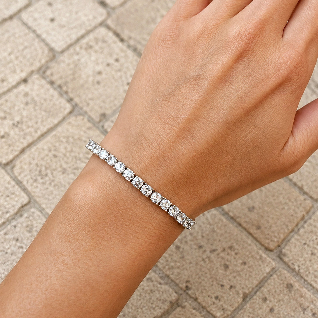 925 sterling silver tennis bracelet with round cubic zirconia stones worn on the wrist