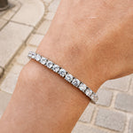 925 sterling silver tennis bracelet with round cubic zirconia stones worn on the wrist