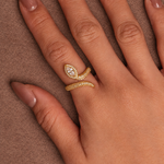 Gold-plated 925 sterling silver snake ring with marquise cubic zirconia and pavé stones worn on fingers