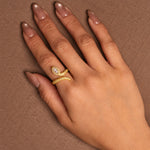Gold-plated 925 sterling silver snake ring with marquise cubic zirconia and pavé stones worn on finger