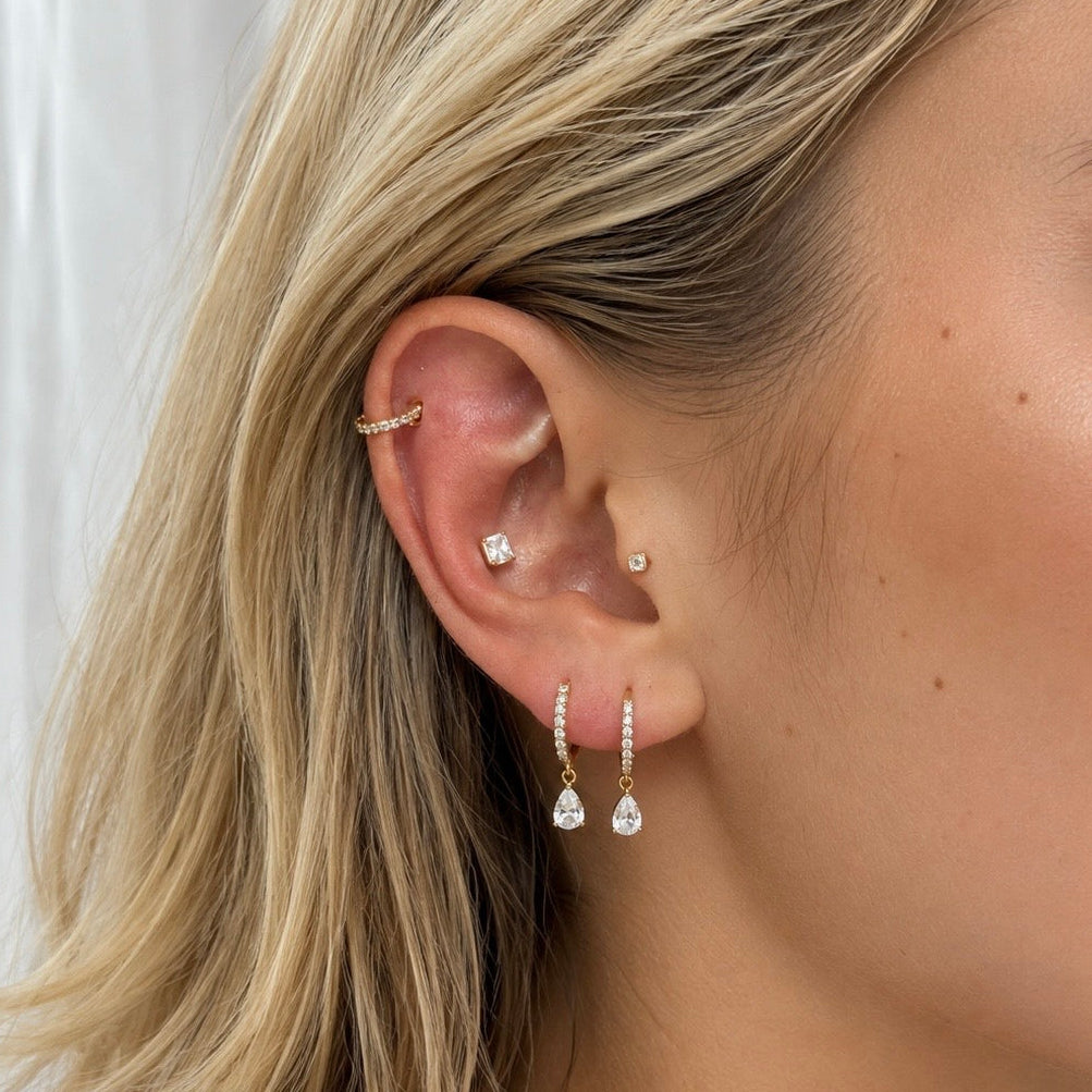 Gold-plated 925 sterling silver hoop earrings with pavé cubic zirconia and teardrop cubic zirconia charms