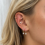 Gold-plated 925 sterling silver hoop earrings with pavé cubic zirconia and teardrop cubic zirconia charms