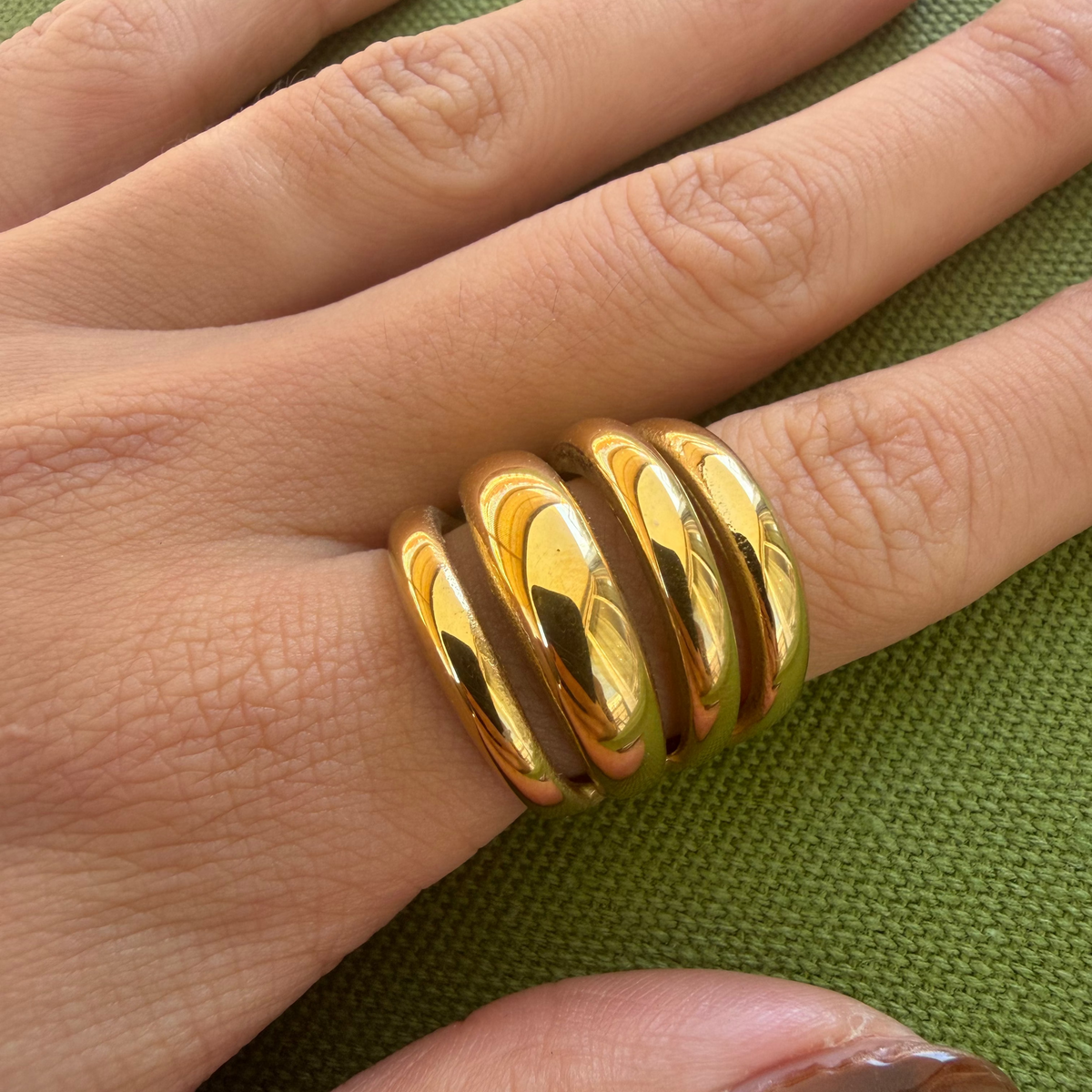 Gold-plated stainless steel chunky ring with four rounded parallel bands