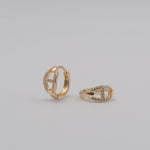 Gold-plated stainless steel huggie earrings with pavé cubic zirconia link details