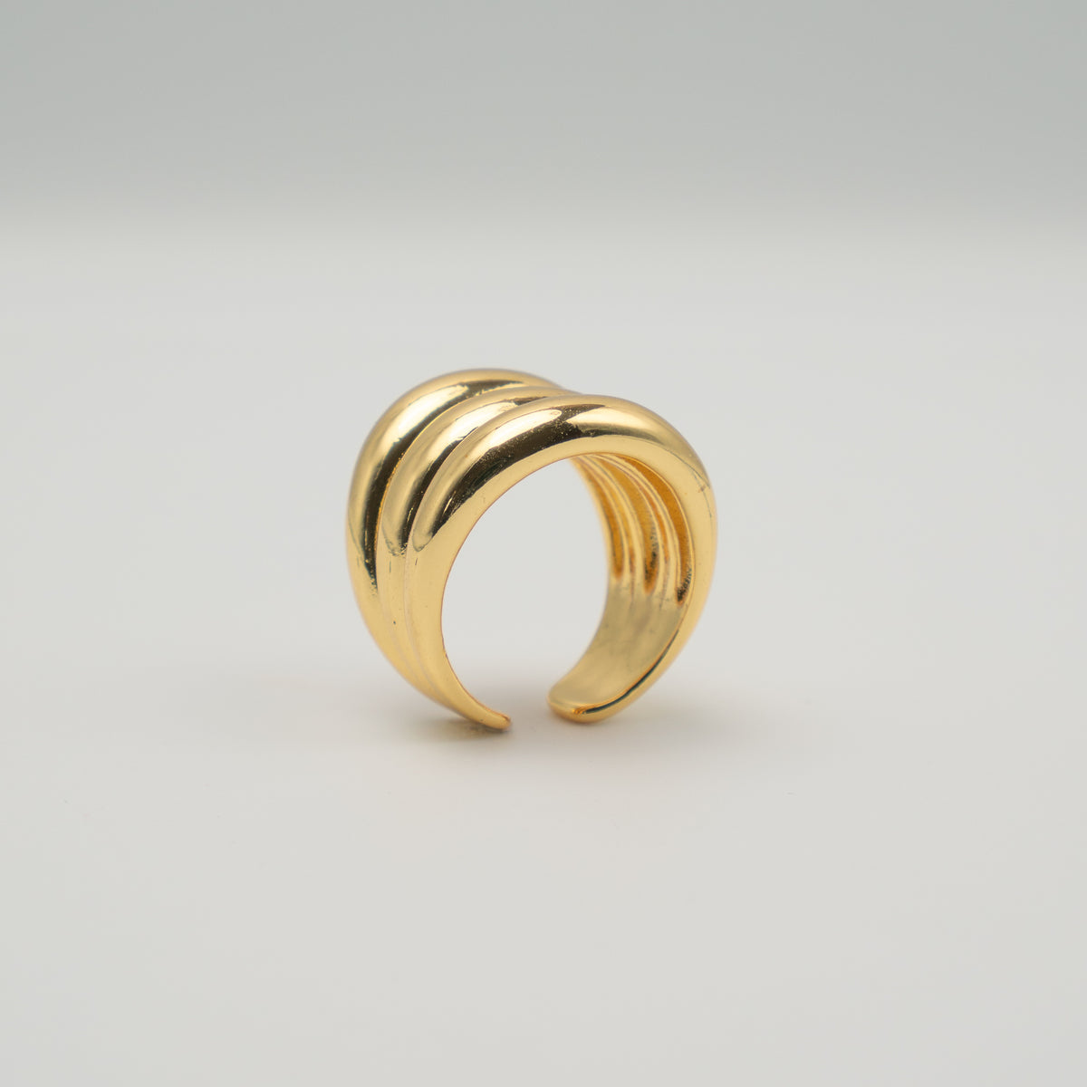 Gold-plated stainless steel chunky ring with three rounded stacked bands 