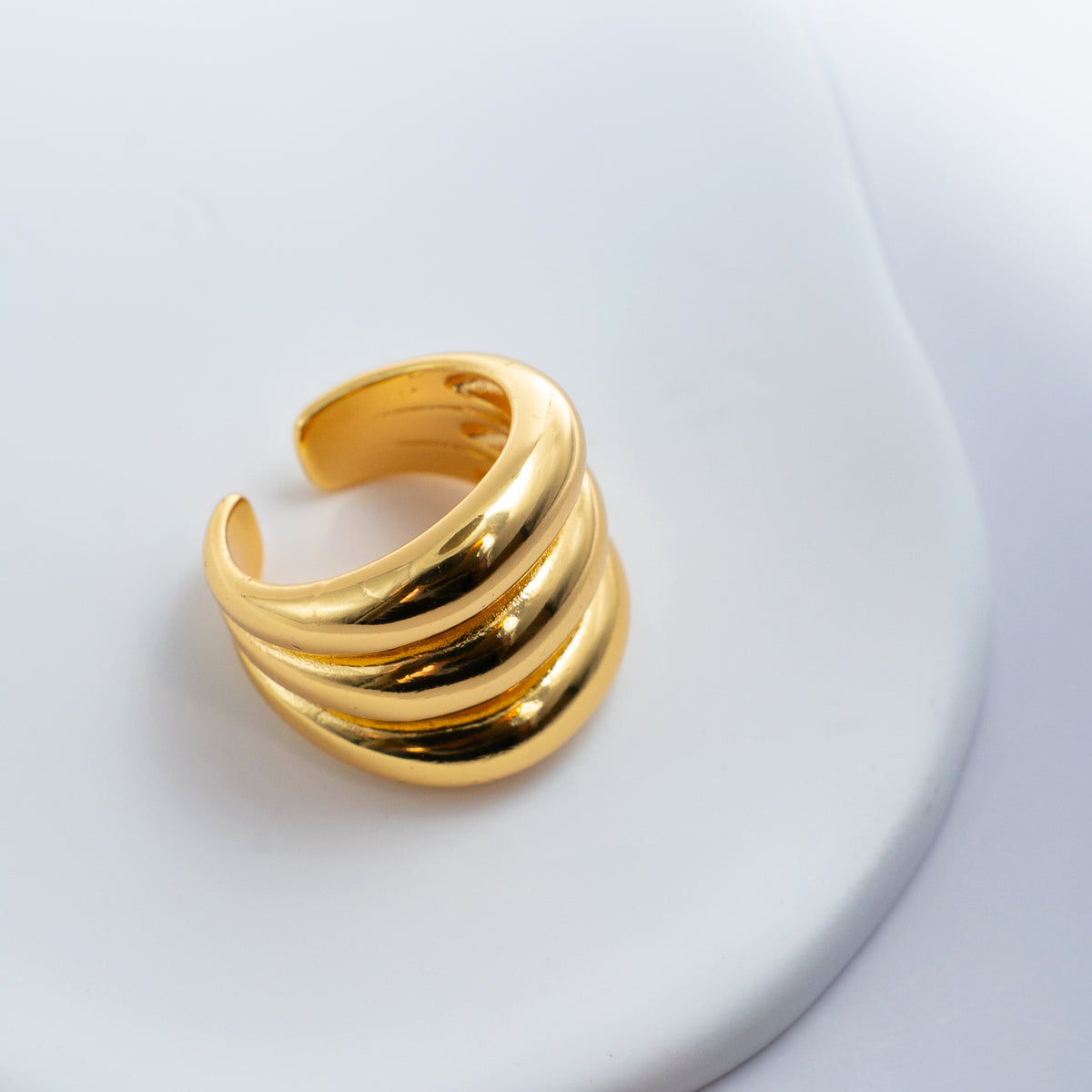 Gold-plated stainless steel chunky ring with three rounded stacked bands 