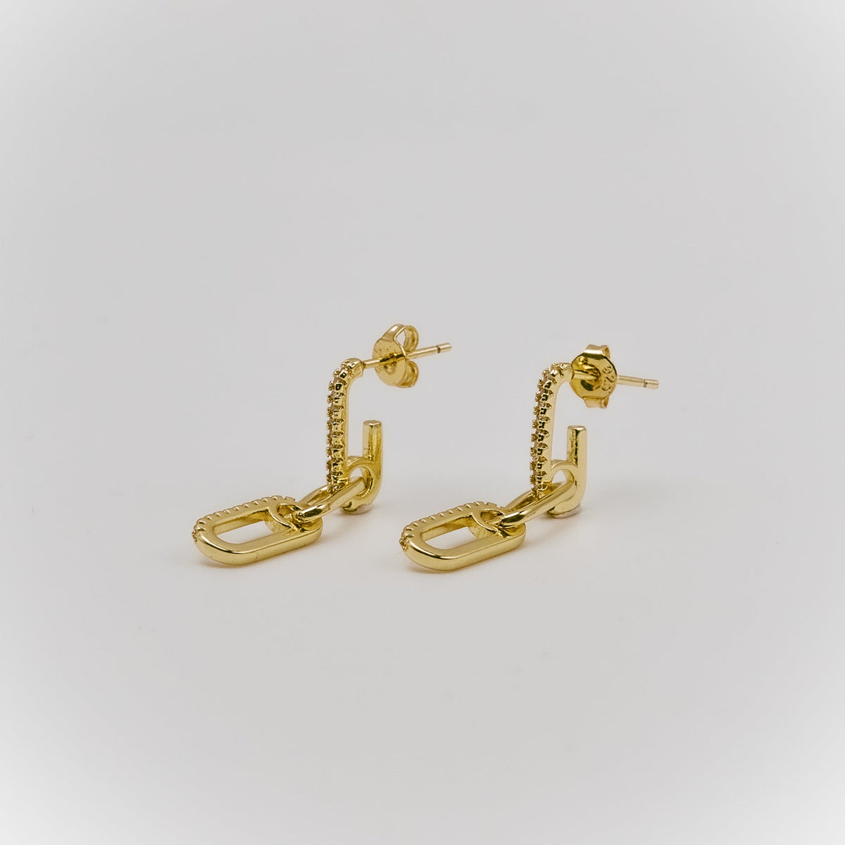Gold-plated sterling silver drop earrings with elongated chain-link details and clear cubic zirconia accents 