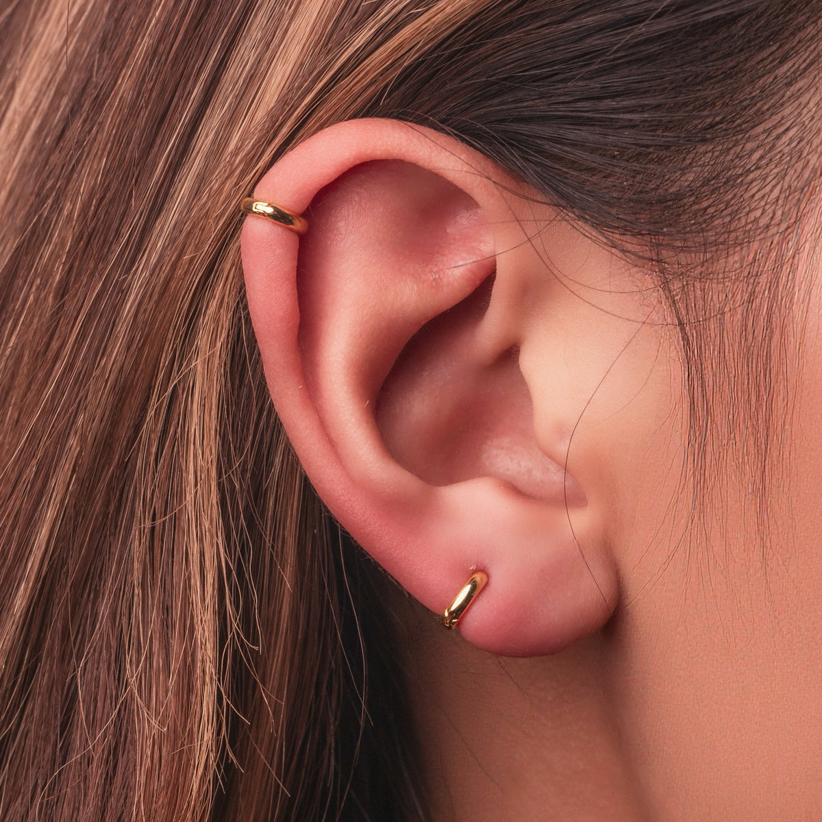 Gold-plated sterling silver classic huggie hoop earrings with a smooth polished finish
