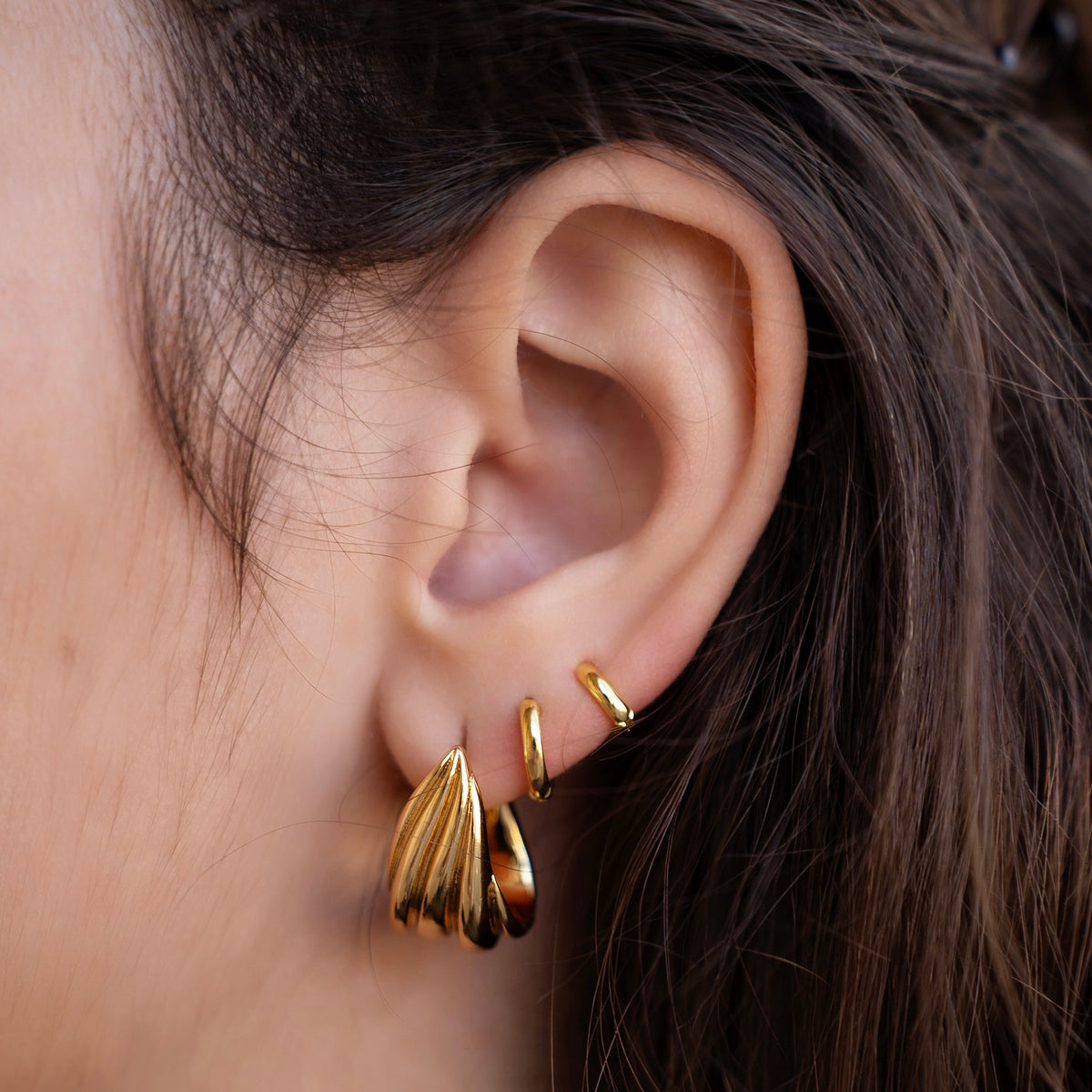 Gold-plated sterling silver classic huggie hoop earrings with a smooth polished finish