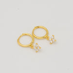 Gold-plated sterling silver hoop earrings with clear cubic zirconia star-shaped drops 