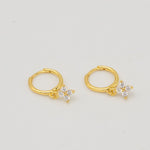 Gold-plated sterling silver hoop earrings with clear cubic zirconia star-shaped drops 