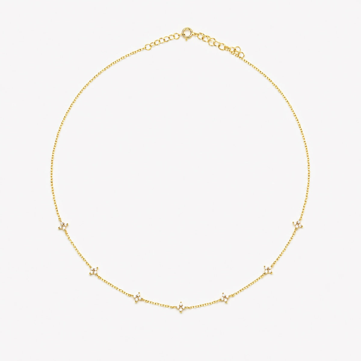 Gold-plated sterling silver station necklace with small clear cubic zirconia floral motifs 
