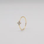 Gold-plated sterling silver flower ring with clear cubic zirconia stones .