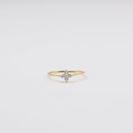 Gold-plated sterling silver flower ring with clear cubic zirconia stones.