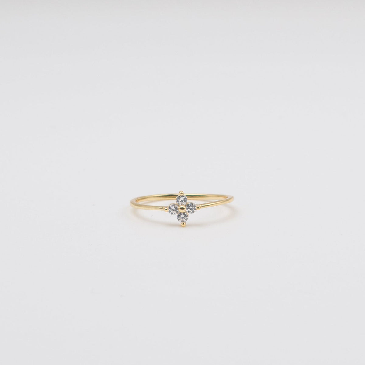 Gold-plated sterling silver flower ring with clear cubic zirconia stones.