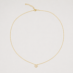 Gold-plated sterling silver necklace with a four-petal cubic zirconia pendant on a light background