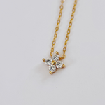 Gold-plated sterling silver necklace with a four-petal clear cubic zirconia pendant