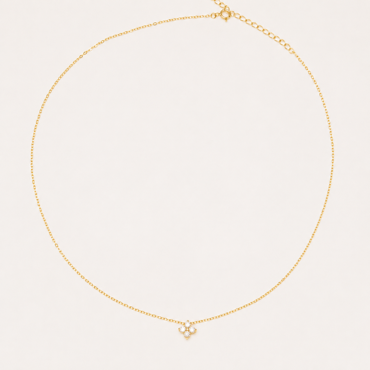 Gold-plated sterling silver necklace with a four-petal clear cubic zirconia pendant