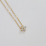 Gold-plated sterling silver necklace with a four-petal clear cubic zirconia pendant 