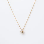 Gold-plated sterling silver necklace with a four-petal clear cubic zirconia pendant 