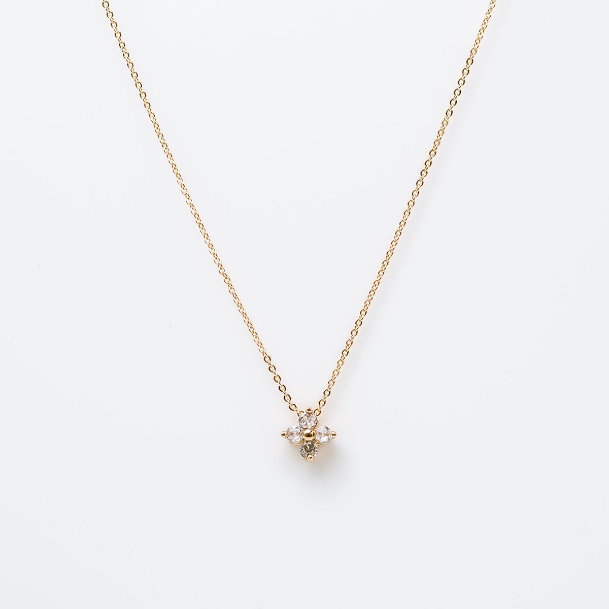 Gold-plated sterling silver necklace with a four-petal clear cubic zirconia pendant 