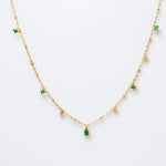 Gold-plated sterling silver necklace with small green cubic zirconia and clear stone charms 