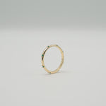 Gold-plated sterling silver delicate band ring with small green stones 