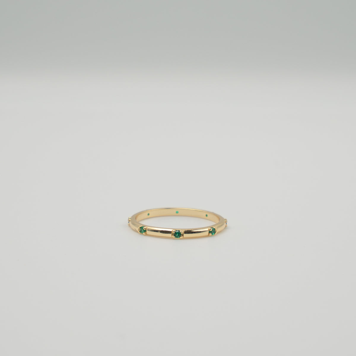 Gold-plated sterling silver delicate band ring with small green stones