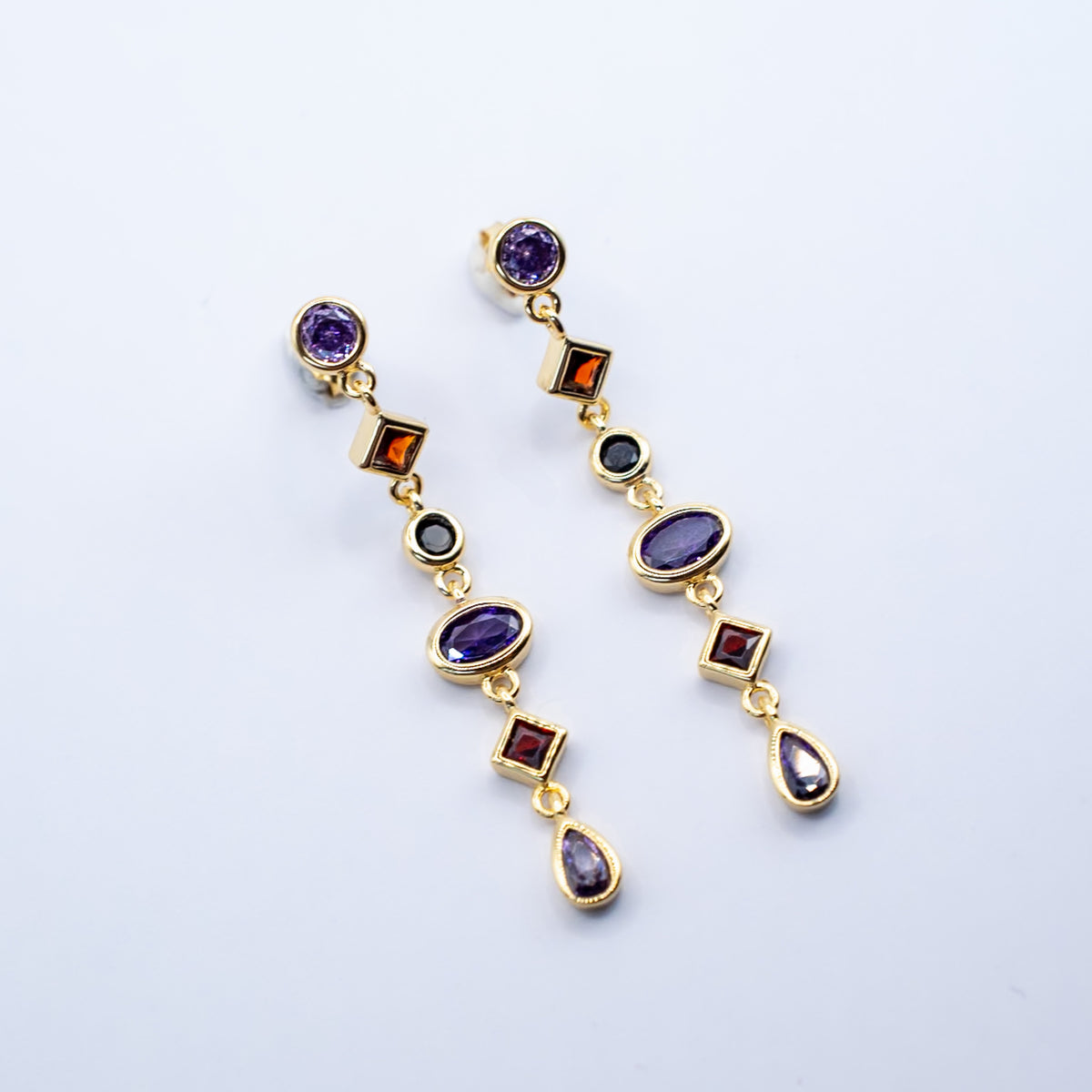 Gold-plated sterling silver drop earrings with purple, orange and black cubic zirconia stones