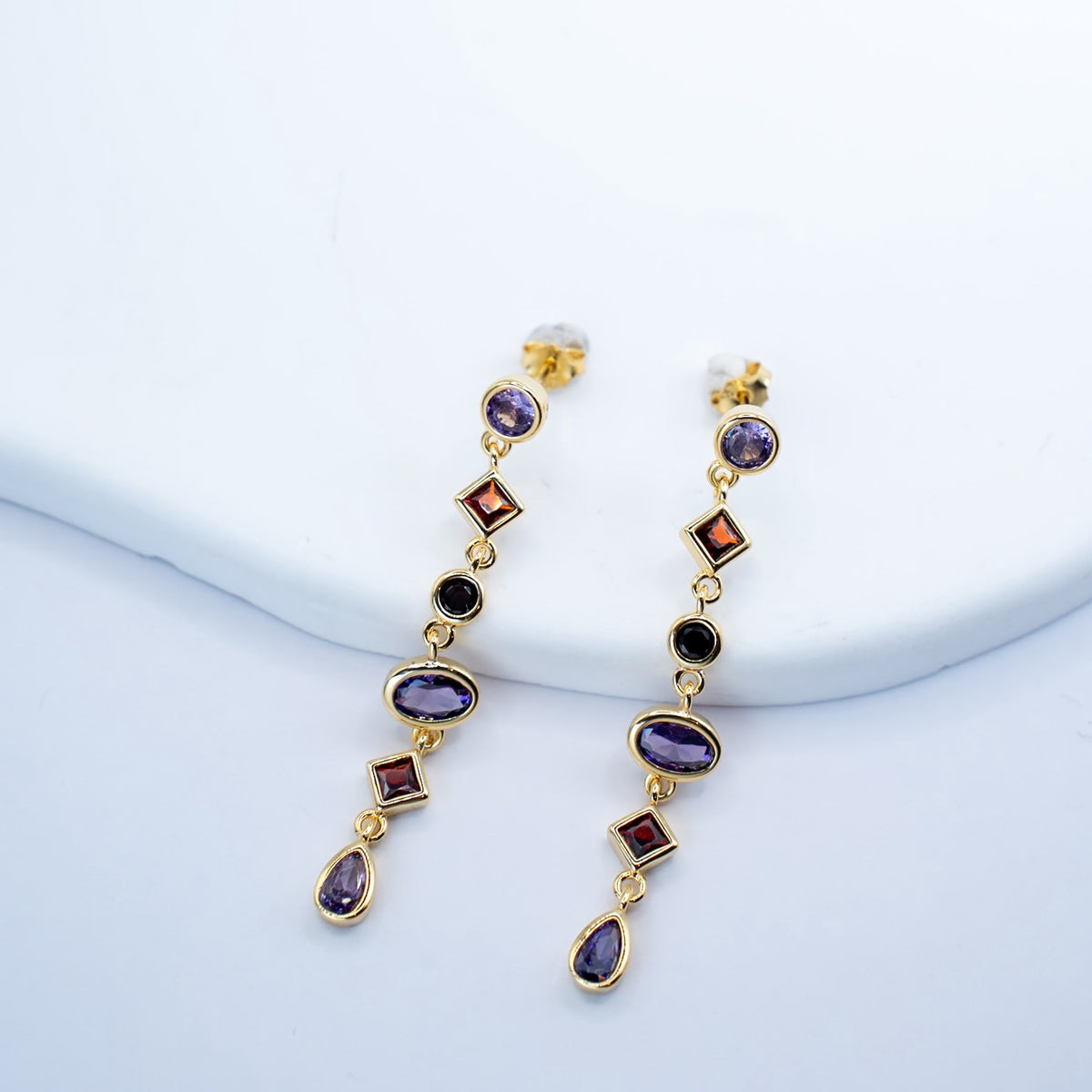 Gold-plated sterling silver drop earrings with purple, orange and black cubic zirconia stones