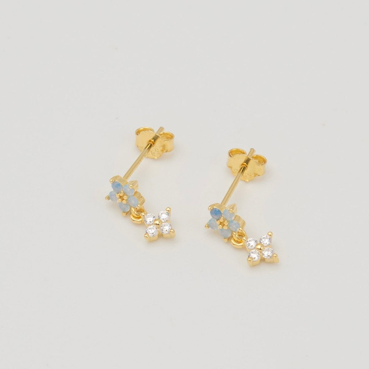 Gold-plated sterling silver stud earrings with opal flower details and clear cubic zirconia