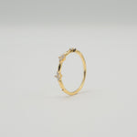 Gold-plated sterling silver ring with three small clover-shaped clear cubic zirconia details 