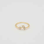 Gold-plated sterling silver ring with three flower motifs set with clear cubic zirconia stones