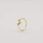 Gold-plated sterling silver ring with three flower motifs set with clear cubic zirconia stones