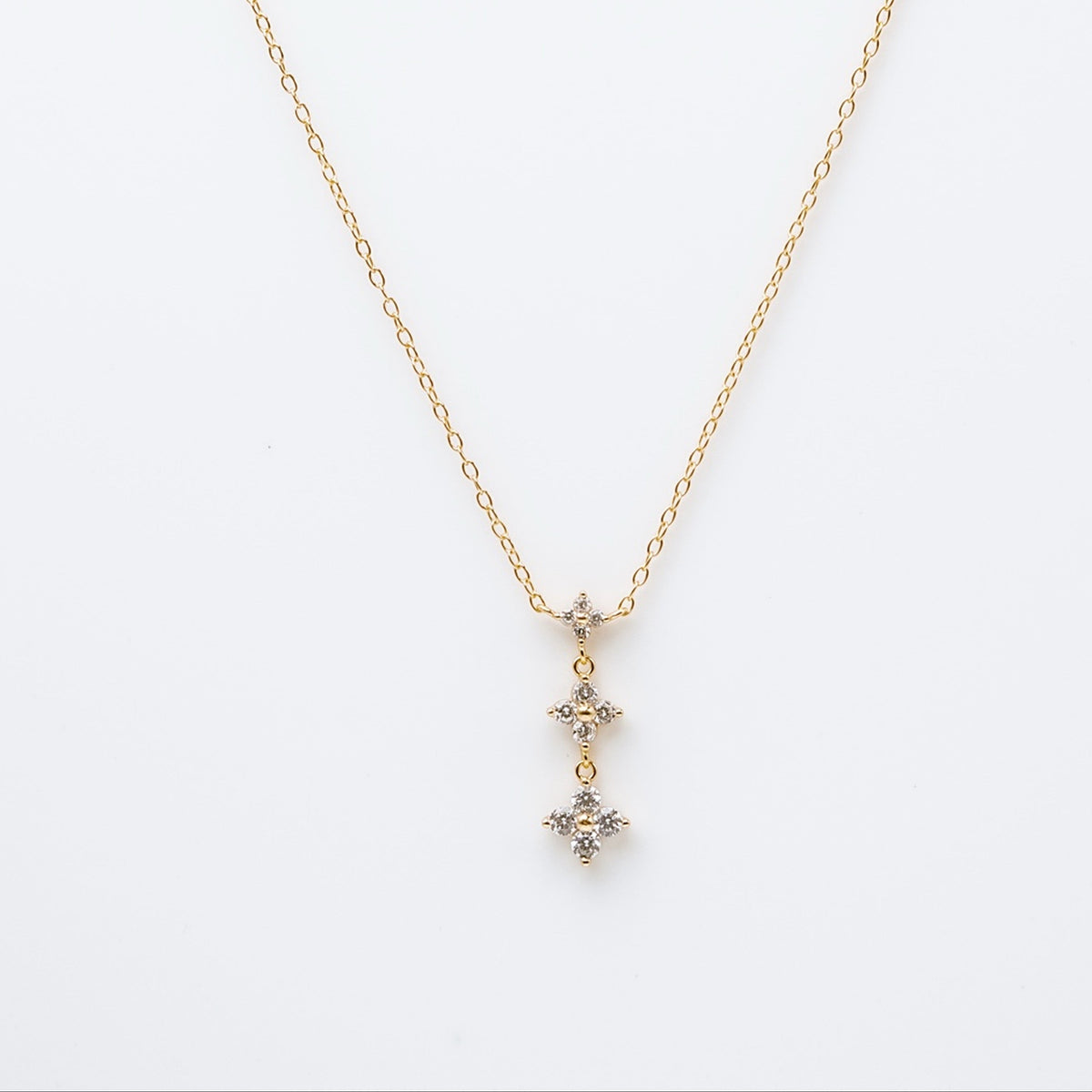 Gold-plated sterling silver drop necklace with three clear cubic zirconia flower motifs