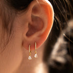 Gold-plated 925 sterling silver hoop earrings with pavé cubic zirconia and teardrop cubic zirconia charms