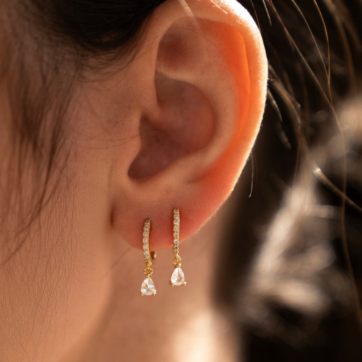 Gold-plated 925 sterling silver hoop earrings with pavé cubic zirconia and teardrop cubic zirconia charms