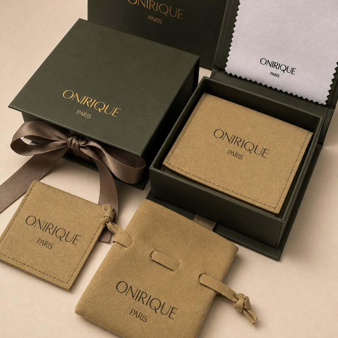 Luxury jewellery gift packaging by ONIRIQUE PARIS with green gift boxes, suede pouches and polishing cloth.