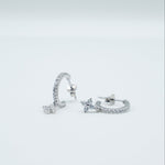 Rhodium-plated 925 sterling silver pavé hoop earrings with flower cubic zirconia charms