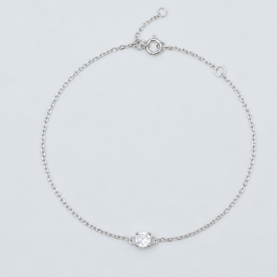 Rhodium-plated 925 sterling silver bracelet with a round cubic zirconia solitaire