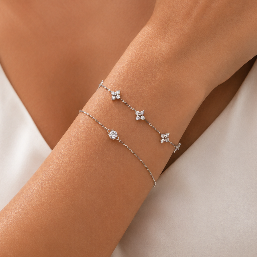 Rhodium-plated 925 sterling silver bracelet with a round cubic zirconia solitaire worn on wrist