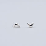 Rhodium-plated sterling silver croissant stud earrings on a light background