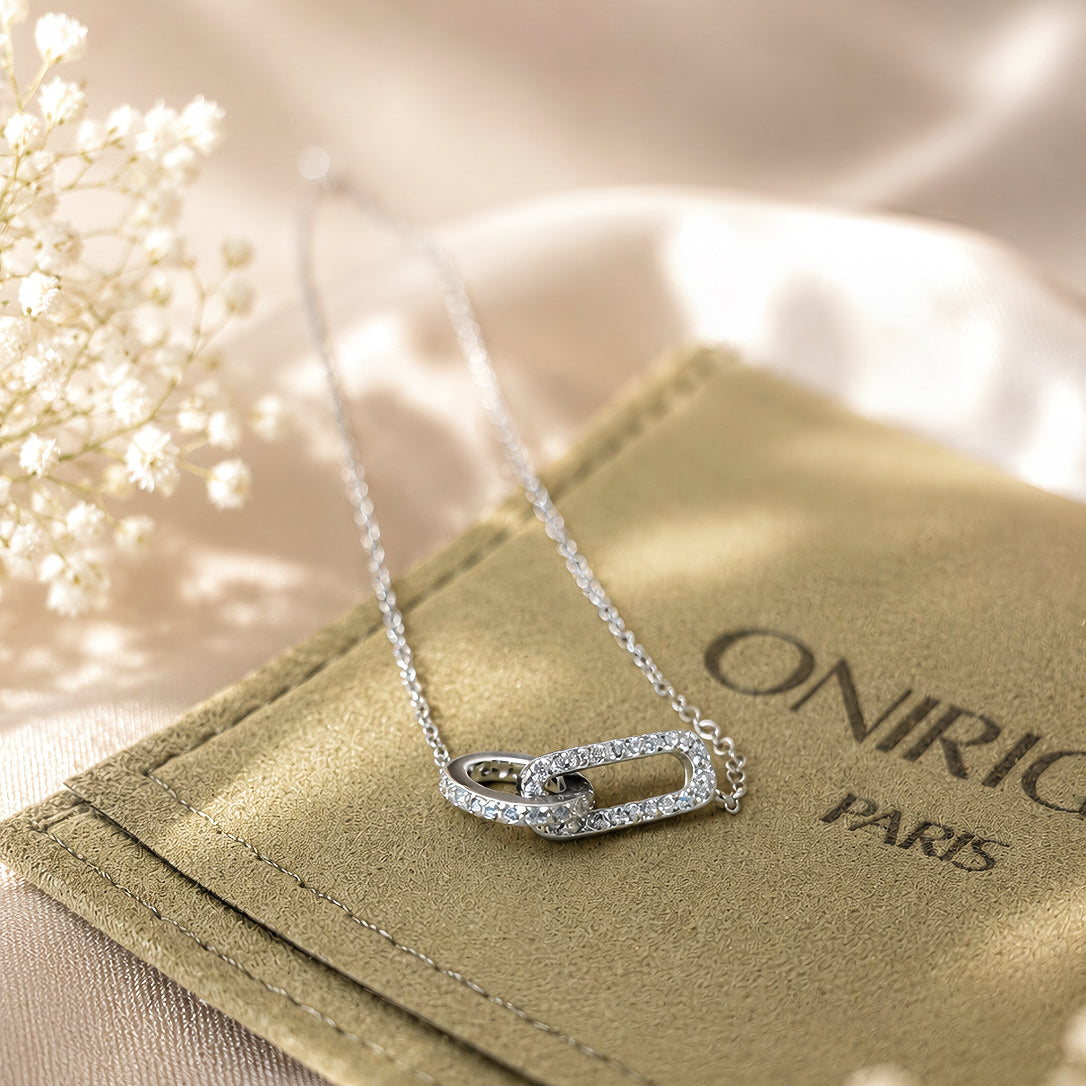 Rhodium-plated sterling silver necklace with interlocking double heart pendant and cubic zirconia stones
