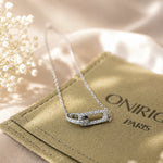 Rhodium-plated sterling silver necklace with interlocking double heart pendant and cubic zirconia stones