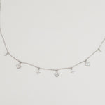 Rhodium-plated sterling silver necklace with delicate cubic zirconia flower charms