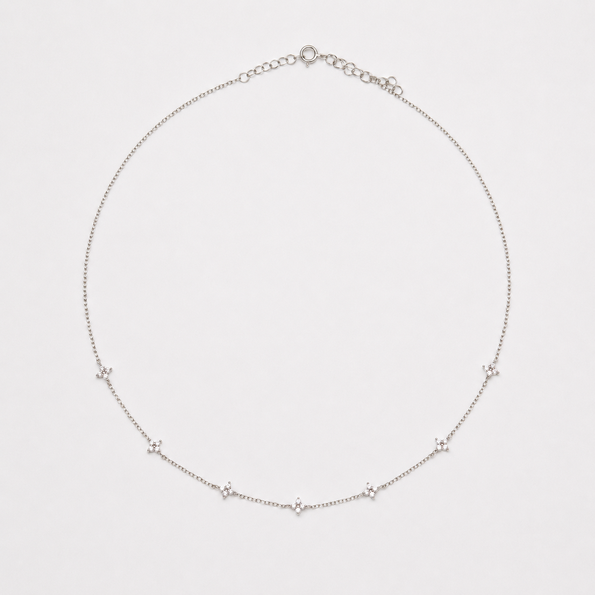Rhodium-plated sterling silver necklace with delicate cubic zirconia flower details