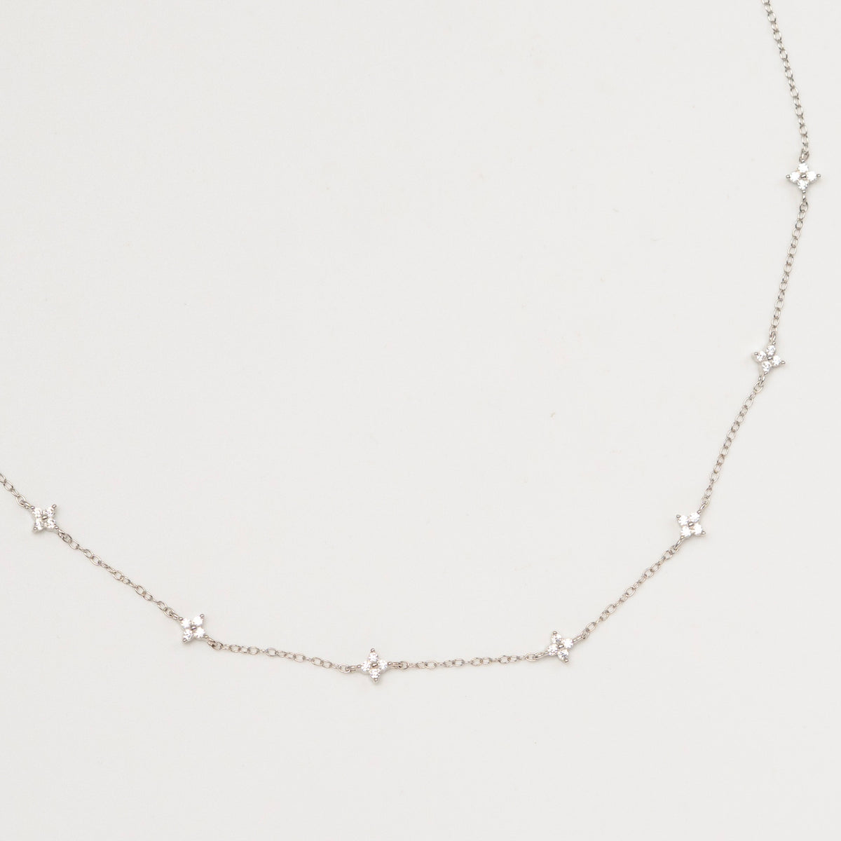 Rhodium-plated sterling silver necklace with delicate cubic zirconia flower details