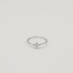 Rhodium-plated sterling silver ring with a delicate four-petal cubic zirconia flower