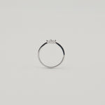 Rhodium-plated sterling silver ring with a delicate four-petal cubic zirconia flower